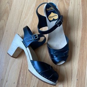 Swedish Hasbeens Black Leather Clog Sandal with Ankle Strap and Buckle Design